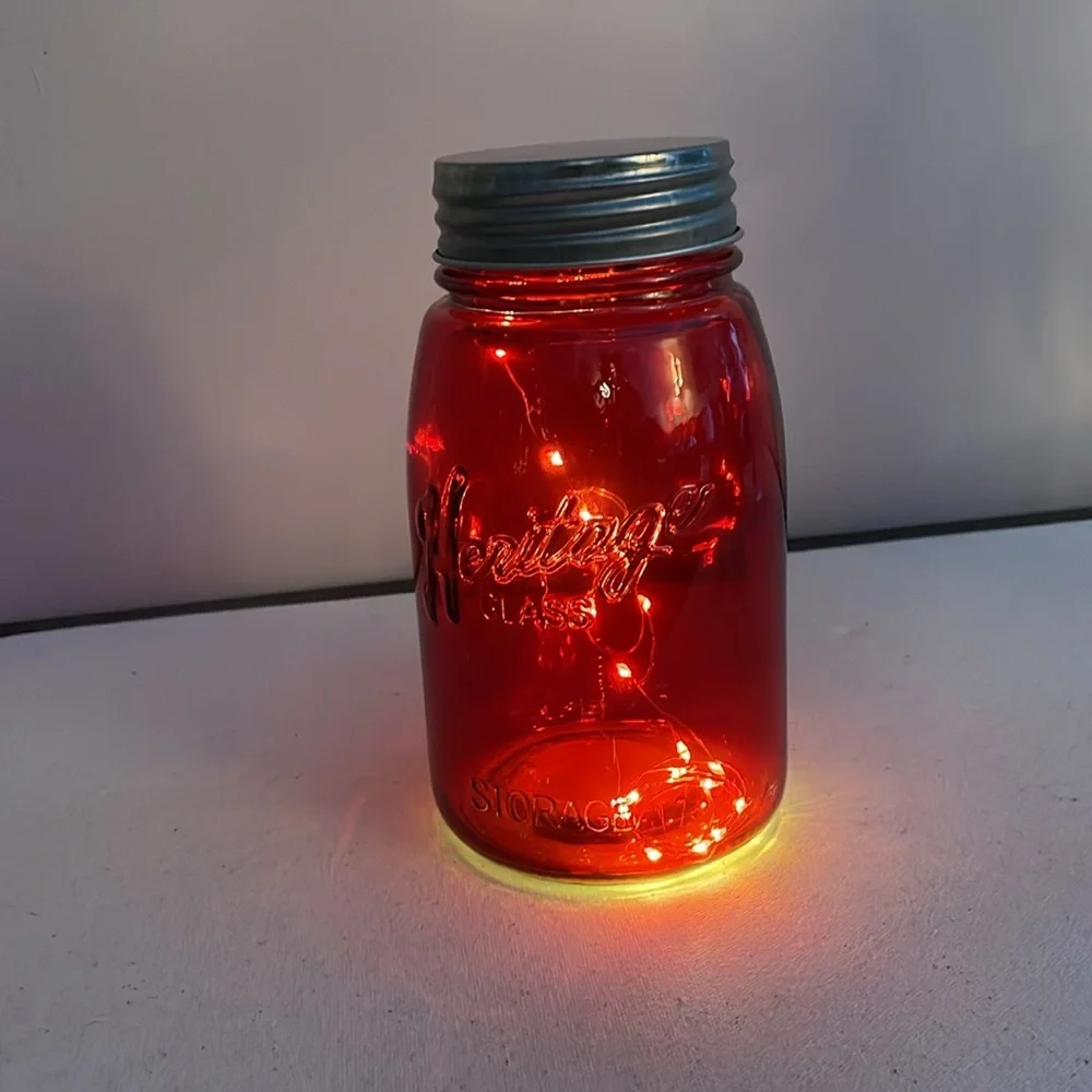 Red Decorative Jar with Lights on inside .